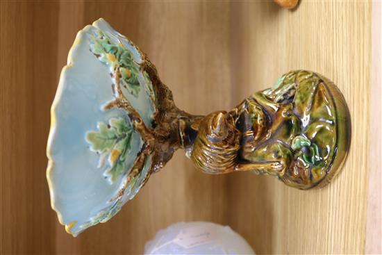 A George Jones majolica comport, the pedestal modelled as a tree trunk with a fox chasing a rabbit,